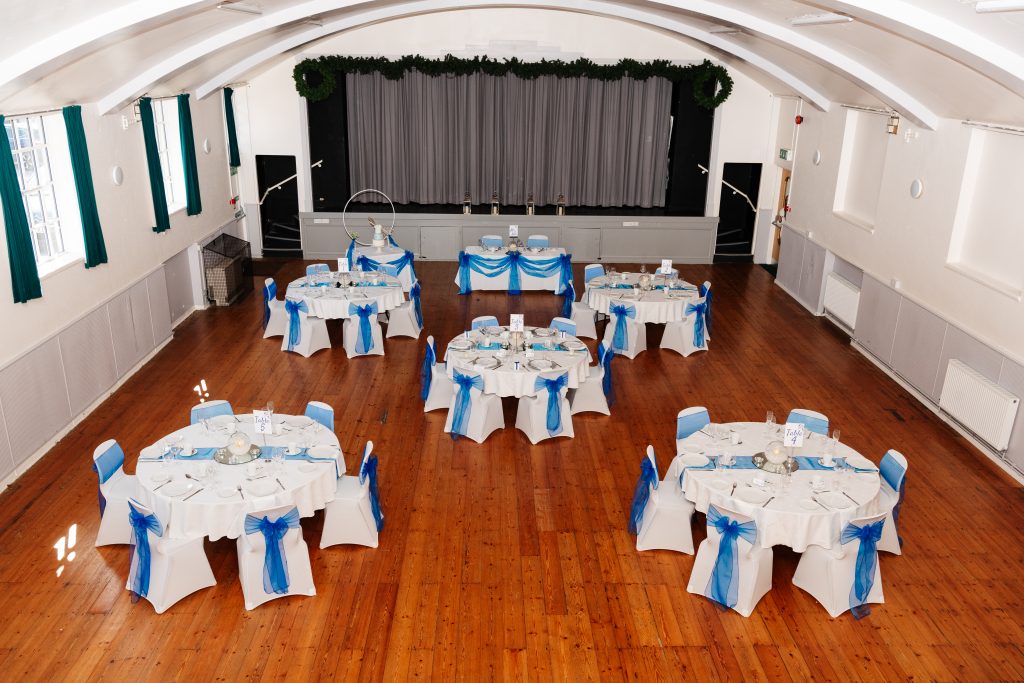 Main Hall from above, 5 circular tables with white and blue decoration.